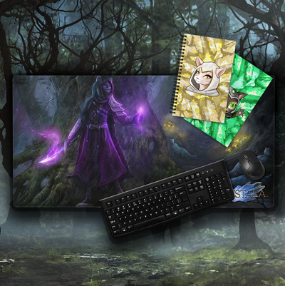 kristala game gaming mouse pad and other home goods featured in the kristala merch shop with kristala logo and black wireless mouse, keyboard, and gaming headset atop a dark fantasy game illustration background
