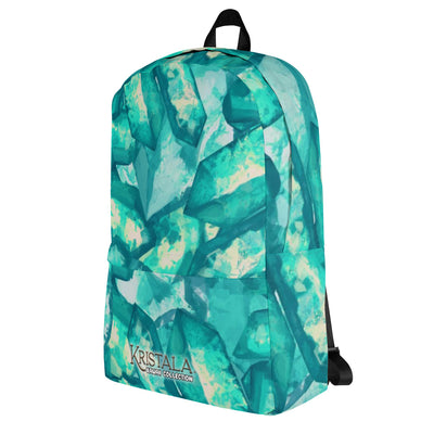 tilted left view of all-over teal blue crystal patterned backpack with the kristala game kawaii collection logo across the bottom black straps white background