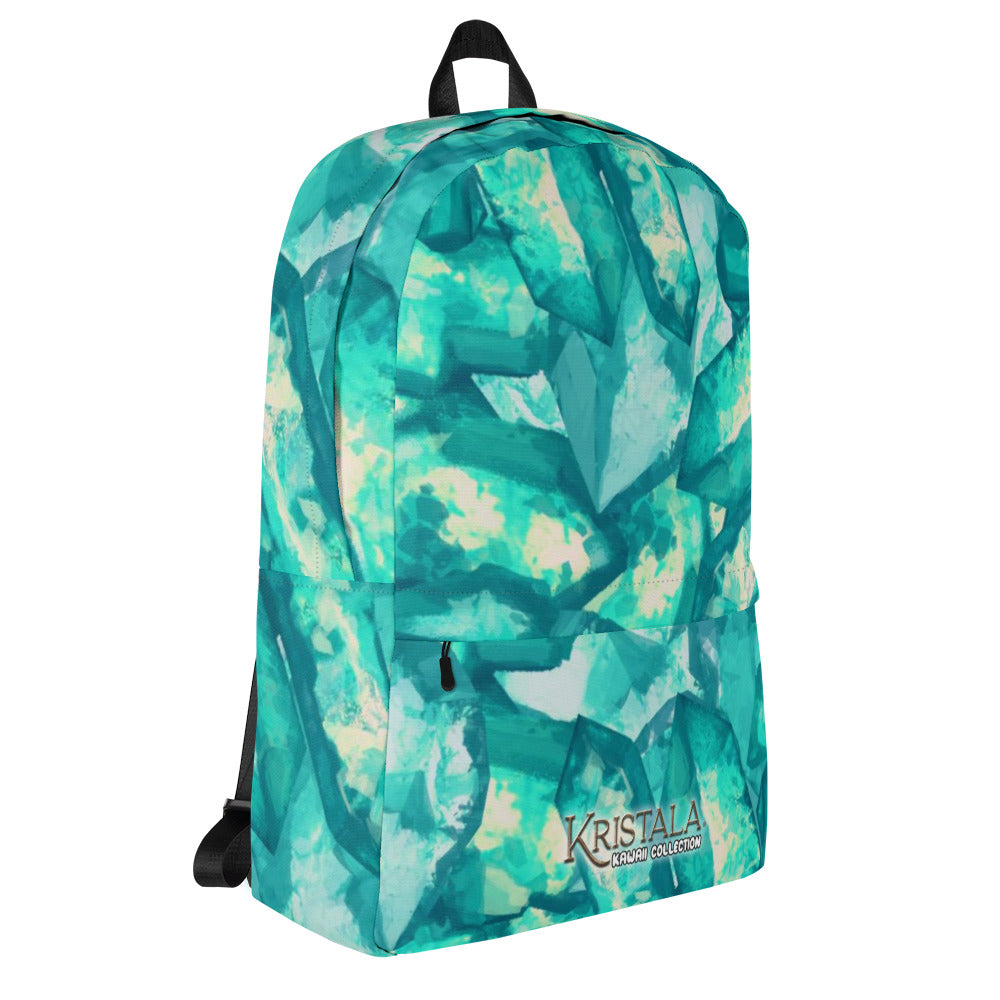 tilted right view of all-over teal blue crystal patterned backpack with the kristala game kawaii collection logo across the bottom black straps white background