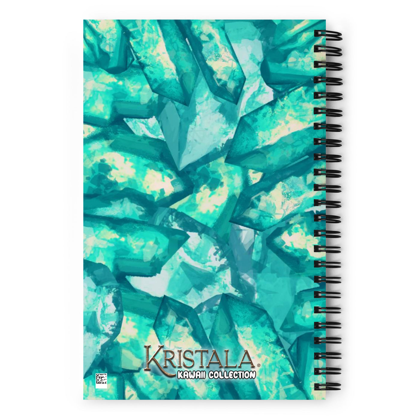 back view of notebook with kawaii logo in front of teal kristal background